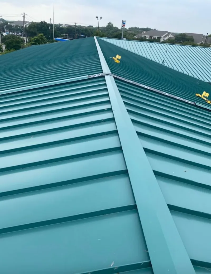 Green commercial metal roof ridge and valley for Metal Roof Repair in Lake Elmo